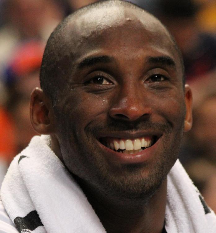 Kobe_Bryant_smiling_on_the_bench_USA_vs_GBR_2012_(cropped).jpg